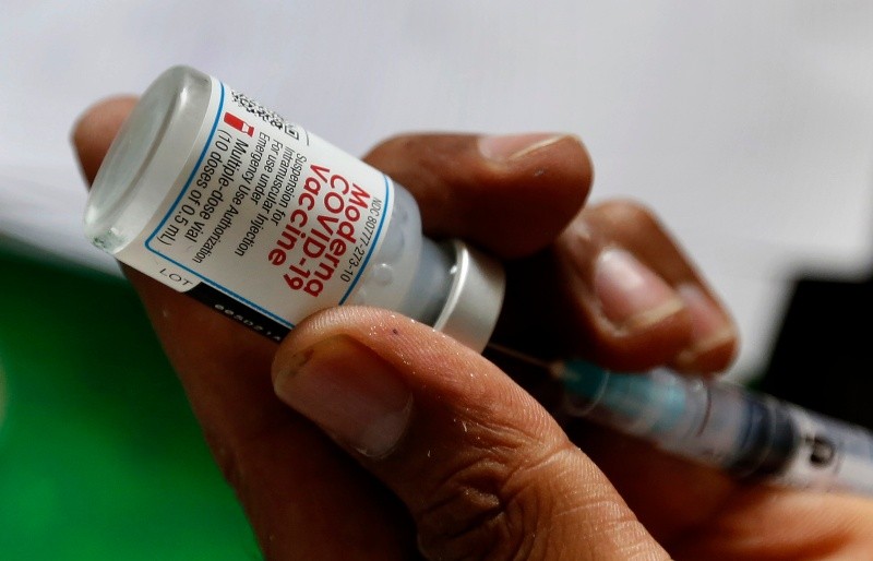 A health worker prepares a Moderna COVID-19 vaccine at a vaccination center, in Lahore, Pakistan, Tuesday, July 6, 2021. Normalcy returned at COVID-19 vaccination centers across Pakistan, days after Washington delivered 2.5 million doses of the Moderna vaccine to Islamabad. That enabled Pakistan's government to overcome shortages of specific vaccines which were needed to inoculate expatriate workers wishing to travel abroad. (AP Photo/K.M. Chaudary)-TUESDAY, JULY 6, 2021 FILE PHOTO